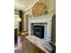Cozy living room featuring a fireplace with brick hearth and decorative mantle at 727 Channing Dr, Atlanta, GA 30318