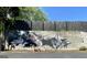 Outdoor art on concrete wall along driveway with small table and lawn ornaments at 727 Channing Dr, Atlanta, GA 30318