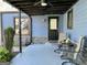 Covered patio featuring a fan, outdoor furniture, and decorative plantings at 727 Channing Dr, Atlanta, GA 30318