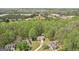 Beautiful home is nestled amongst a vast forest of trees with commercial development in the distance at 6435 Philips Creek Dr, Cumming, GA 30041