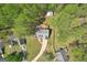 Home with a driveway, a deck, a back yard and mature trees giving it a secluded feeling at 6435 Philips Creek Dr, Cumming, GA 30041