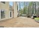 Spacious back deck featuring an outdoor dining area, grill, and access to the home at 6435 Philips Creek Dr, Cumming, GA 30041