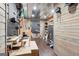 Finished basement offers ample storage with wall slats and organization for the handyman at 6435 Philips Creek Dr, Cumming, GA 30041