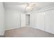 Spacious bedroom features carpet, ceiling fan, and closet, providing comfortable space at 6435 Philips Creek Dr, Cumming, GA 30041