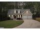 Charming two-story home with a well-manicured lawn and a two car garage at 6435 Philips Creek Dr, Cumming, GA 30041