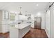 Modern kitchen featuring granite countertops, stainless steel appliances, island and ample storage at 6435 Philips Creek Dr, Cumming, GA 30041