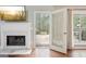 Cozy living room with fireplace and access to outdoor deck at 6435 Philips Creek Dr, Cumming, GA 30041