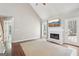 Inviting living room with fireplace, hardwood floors, and access to the outdoor at 6435 Philips Creek Dr, Cumming, GA 30041