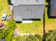 Aerial view of backyard with a gray roof house with a white patio in a residential neighborhood at 6844 Saganaw Dr, Rex, GA 30273