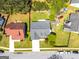 Aerial view of a home with gray roof, driveway, and a small yard in a residential neighborhood at 6844 Saganaw Dr, Rex, GA 30273