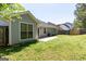 Backyard showcasing the house and grassy area at 6844 Saganaw Dr, Rex, GA 30273