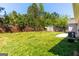 Well maintained backyard with retaining wall, shed, and patio at 6844 Saganaw Dr, Rex, GA 30273
