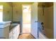 Bathroom with a large mirror, modern vanity, and a combination tub and shower, designed for comfort and style at 6844 Saganaw Dr, Rex, GA 30273