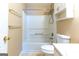 Bathroom featuring a tub and shower combo, white toilet, and a vanity with storage for added convenience at 6844 Saganaw Dr, Rex, GA 30273