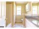 Well-lit bathroom with a shower-tub combo, white vanity, and medicine cabinet offering convenience and functionality at 6844 Saganaw Dr, Rex, GA 30273