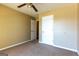 Bedroom with two closets, ceiling fan and neutral carpet at 6844 Saganaw Dr, Rex, GA 30273