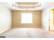 Large bedroom with a trey ceiling and large window at 6844 Saganaw Dr, Rex, GA 30273