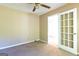 Bedroom with a ceiling fan and access to the bathroom at 6844 Saganaw Dr, Rex, GA 30273