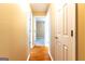Hallway with hardwood floors and multiple rooms at 6844 Saganaw Dr, Rex, GA 30273
