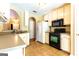 Bright kitchen features ample cabinetry, tile floor, and modern appliances at 6844 Saganaw Dr, Rex, GA 30273