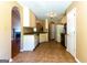 An open kitchen featuring tile flooring and a view into the living space at 6844 Saganaw Dr, Rex, GA 30273