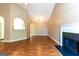Spacious living room with vaulted ceiling, fireplace, and wood-look flooring at 6844 Saganaw Dr, Rex, GA 30273