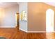 Open-concept living room with hardwood floors and views of the kitchen at 6844 Saganaw Dr, Rex, GA 30273