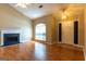Living room with fireplace, entry door, and beautiful flooring at 6844 Saganaw Dr, Rex, GA 30273