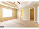 The main bedroom has trey ceilings and two closets at 6844 Saganaw Dr, Rex, GA 30273