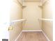 Walk-in closet with carpet and shelving, offering ample storage space for clothing and accessories at 6844 Saganaw Dr, Rex, GA 30273