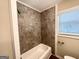 Bathroom with a new bathtub with tile surround and a window letting in natural light at 1089 Canal St, Decatur, GA 30032