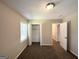 Bedroom with a carpeted floor, a closet, two windows, and a neutral color palette at 1089 Canal St, Decatur, GA 30032