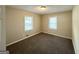 Bedroom with plush carpeting and two windows creating a bright and airy feel at 1089 Canal St, Decatur, GA 30032