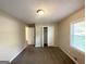 Bedroom featuring neutral walls, closet, carpeted floor, and natural light at 1089 Canal St, Decatur, GA 30032