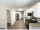 Updated kitchen offers sleek stainless steel appliances and crisp white cabinetry at 1089 Canal St, Decatur, GA 30032