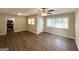 Open-concept living area boasts updated flooring, natural light, and a view of the kitchen at 1089 Canal St, Decatur, GA 30032