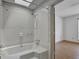 Bathroom with a bathtub, shower, and skylight, providing a bright and airy space at 322 Wood Rdg, Peachtree City, GA 30269
