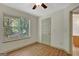 Bright bedroom with natural light from large windows and wood-look flooring, creating a cozy and inviting space at 322 Wood Rdg, Peachtree City, GA 30269