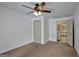 Cozy bedroom featuring carpet flooring, a ceiling fan, and a closet, offering comfort and functionality at 322 Wood Rdg, Peachtree City, GA 30269