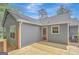 Charming home exterior featuring a well-maintained deck, gray siding, and an inviting outdoor space at 322 Wood Rdg, Peachtree City, GA 30269