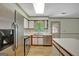 Bright kitchen with stainless steel appliances, white cabinets, and hardwood floors at 322 Wood Rdg, Peachtree City, GA 30269