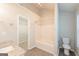 Bathroom with shower and bathtub, as well as a view of the walk-in closet at 7161 Bowie Dr, Lithonia, GA 30038
