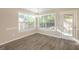 Sunlit dining area features hardwood floors and a glass paneled exterior door at 7161 Bowie Dr, Lithonia, GA 30038