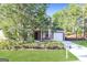 Charming home featuring a brick facade, manicured lawn, and attached garage at 7161 Bowie Dr, Lithonia, GA 30038