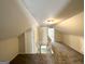 Finished attic features gray carpet and an open stairway at 2361 Whites Mill Rd, Decatur, GA 30032