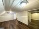 Finished basement features wood flooring and paneled walls at 2361 Whites Mill Rd, Decatur, GA 30032
