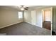 Bedroom with neutral walls, gray carpet, closet, and an open door at 2361 Whites Mill Rd, Decatur, GA 30032