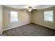 A neutral bedroom features two windows and ceiling fan at 2361 Whites Mill Rd, Decatur, GA 30032
