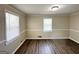 Inviting bedroom space with dark floors, neutral wall, and natural light, creating a calming retreat at 2361 Whites Mill Rd, Decatur, GA 30032