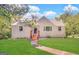 Charming single-Gathering home featuring a well-maintained lawn and inviting front entrance with stone accents at 2361 Whites Mill Rd, Decatur, GA 30032